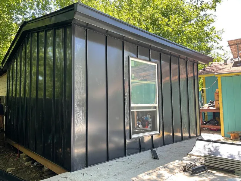 Black standing seam metal wall panels for Roof Inspection in Dunlap